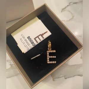 Burberry letter E charm